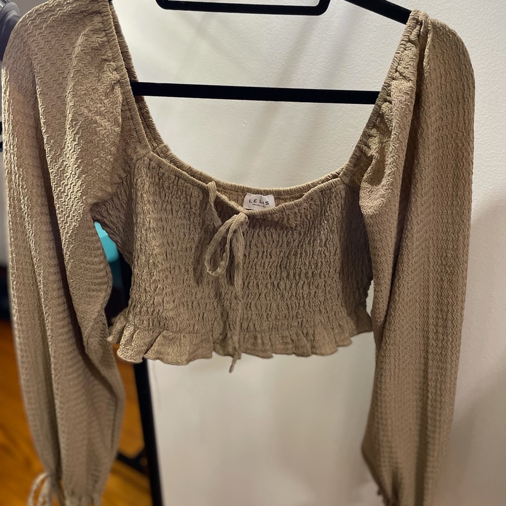 Le Lis tan long sleeve cropped top.